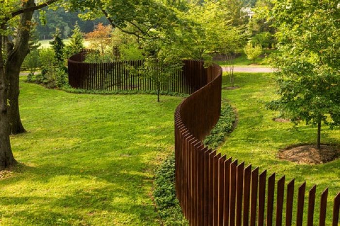 A fence made up of vertical metal posts
